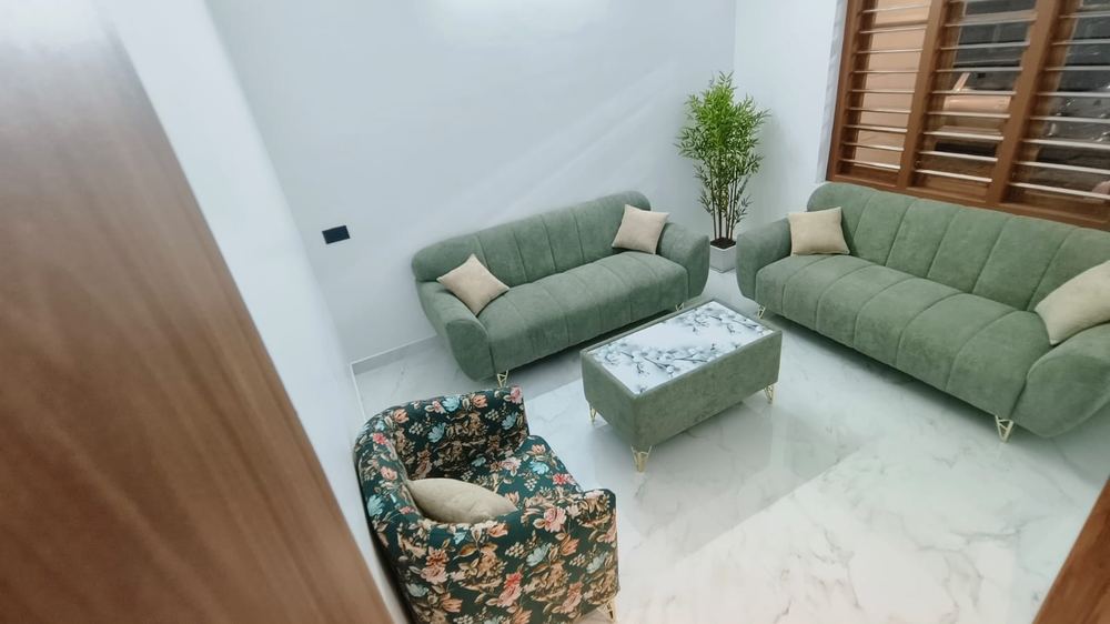 Sage green sofa set with floral armchair